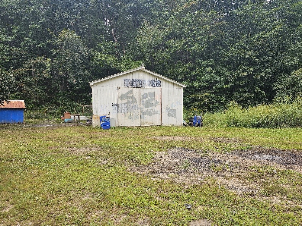 1685 Ennis Branch Road McEwen, TN 37101 - Photo 2 of 9 a view of a house with a yard
