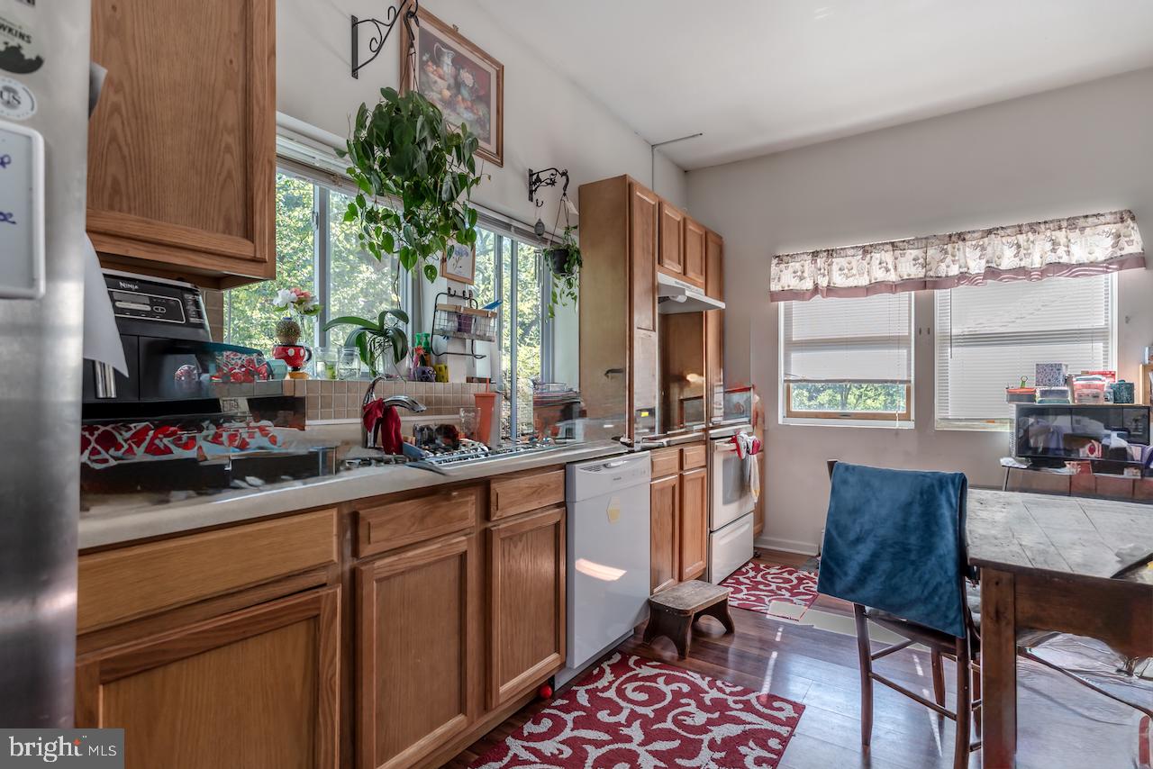 1220 Hay Road Temple, PA 19560 - Photo 14 of 24 a kitchen with a sink stove and cabinets