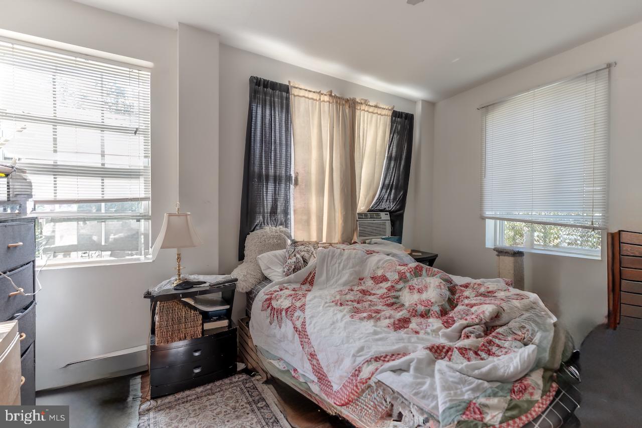 1220 Hay Road Temple, PA 19560 - Photo 17 of 24 a bedroom with a bed and a window with chair