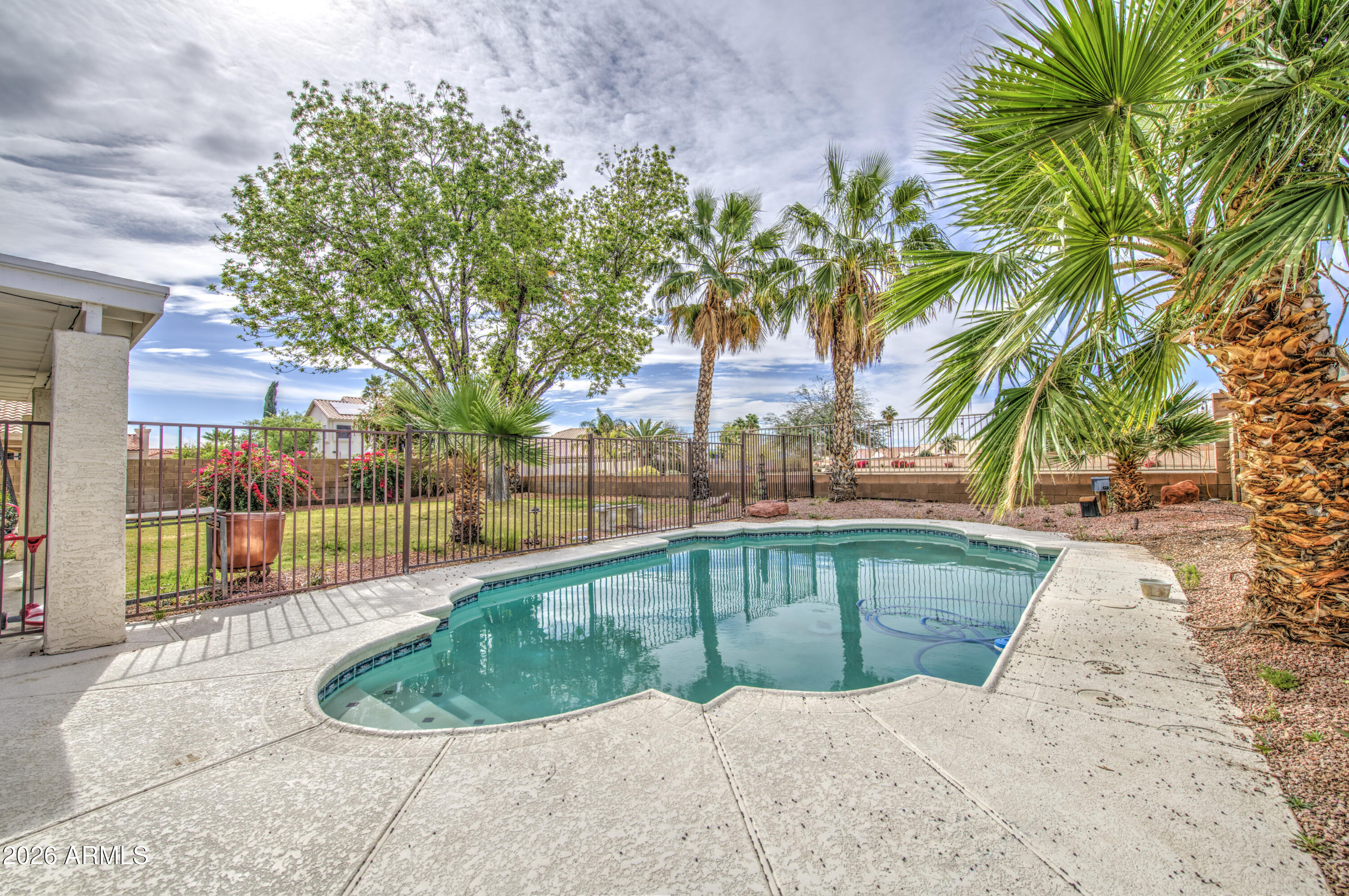 12403 West Monte Vista Road Avondale, AZ 85392 - Photo 50 of 63 a view of a swimming pool with a patio