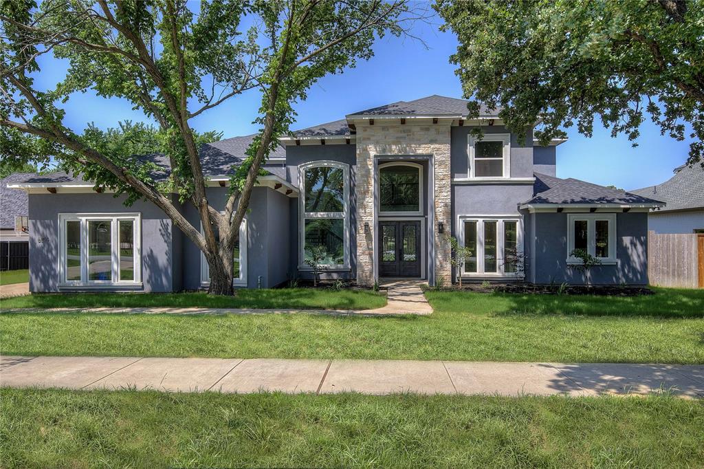 6804 Herbert Road Colleyville, TX 76034 - Photo 1 of 1 a front view of a house with a garden