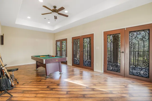 a view of a livingroom with furniture window and wooden floor