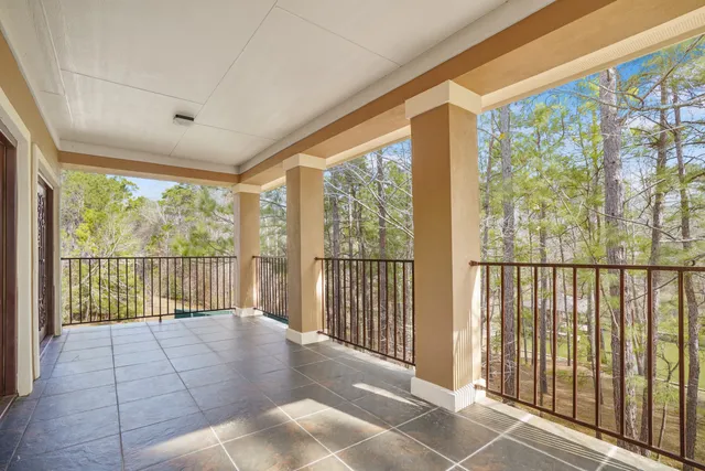 a view of a porch with a floor to ceiling window