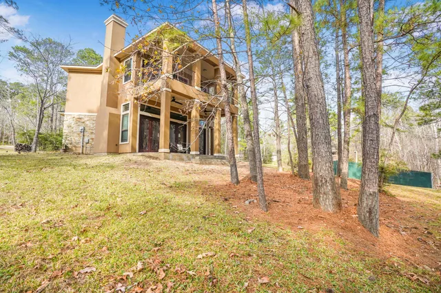 a view of a large building with large trees