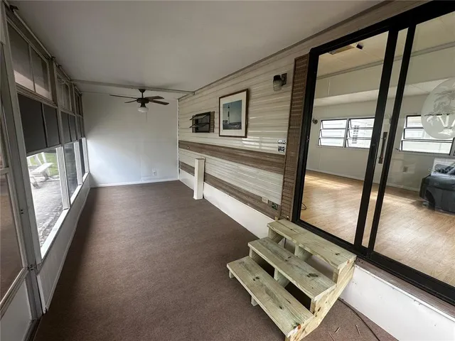 a view of a hallway with windows