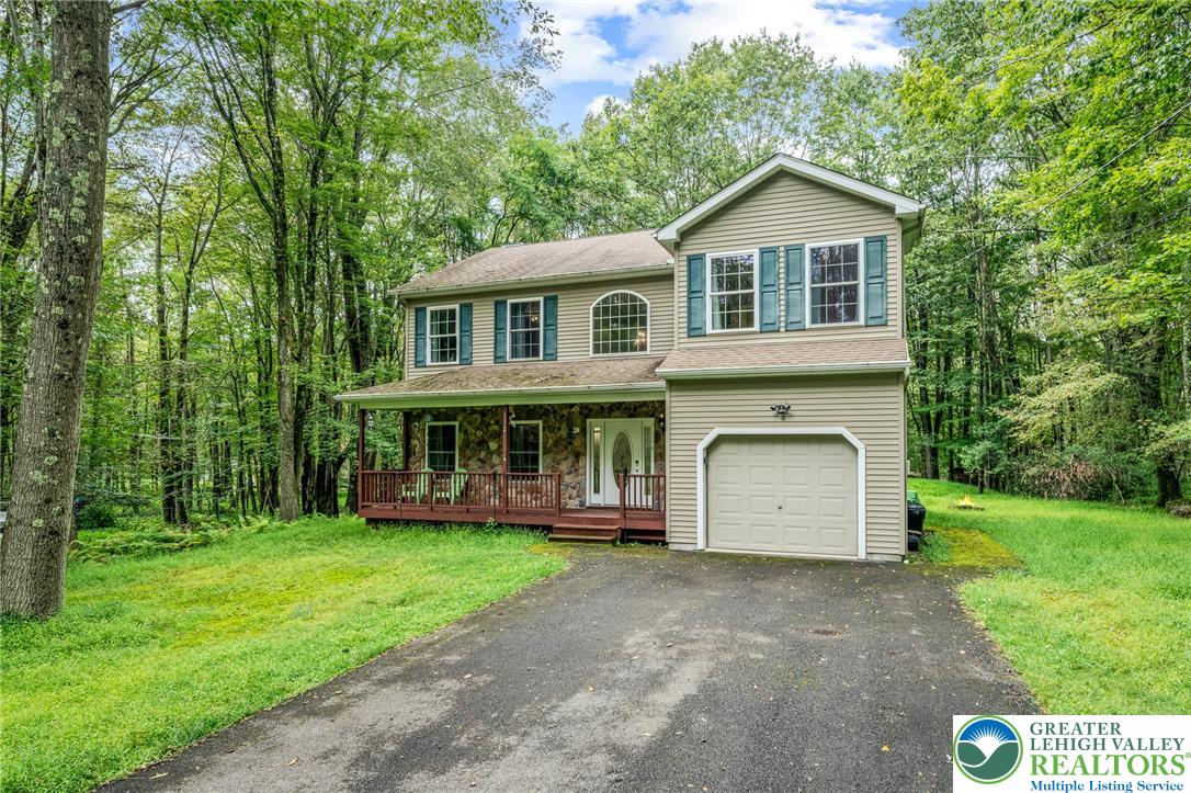 117 Ridge Road Pocono Lake, PA 18347 - Photo 2 of 41 a view of a house with a yard and large trees