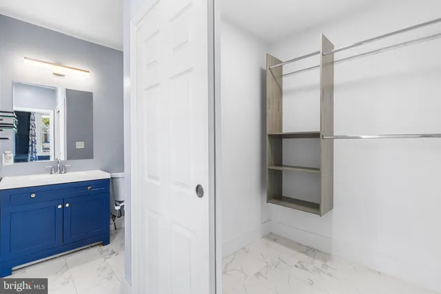 a bathroom with a shower and a sink