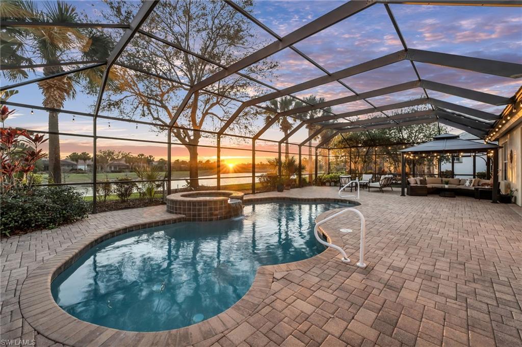 12080 Wicklow Lane Naples, FL 34120 - Photo 1 of 36 Outdoor pool area with sunset views