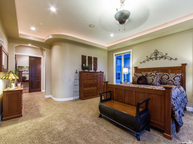 4378 Foothill Drive Bountiful, UT 84010 - Photo 19 of 46 Carpeted room featuring a tray ceiling with cove lighting and recessed fixtures