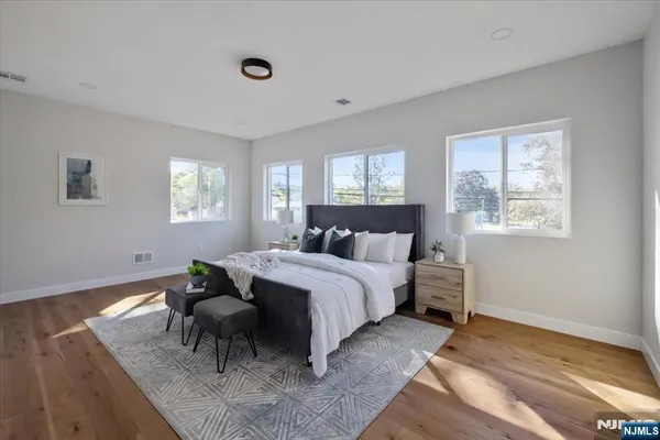 a bed room with a bed and a window