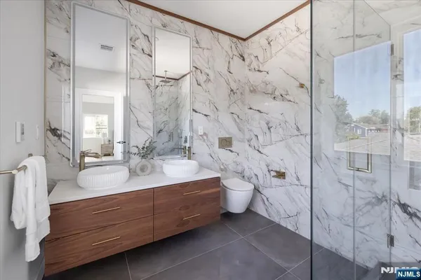 a bathroom with a bathtub and a shower