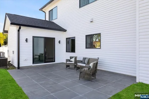 a kitchen with a table chairs refrigerator and cabinets