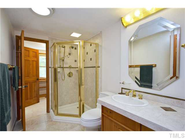 3729 Bosco Road New Hill, NC 27562 - Photo 14 of 25 One of two master bathroom. Tile flooring, tile counter tops, solar tub w/light and access to one of the master suites two walk-in closets. Master Bath/Spa