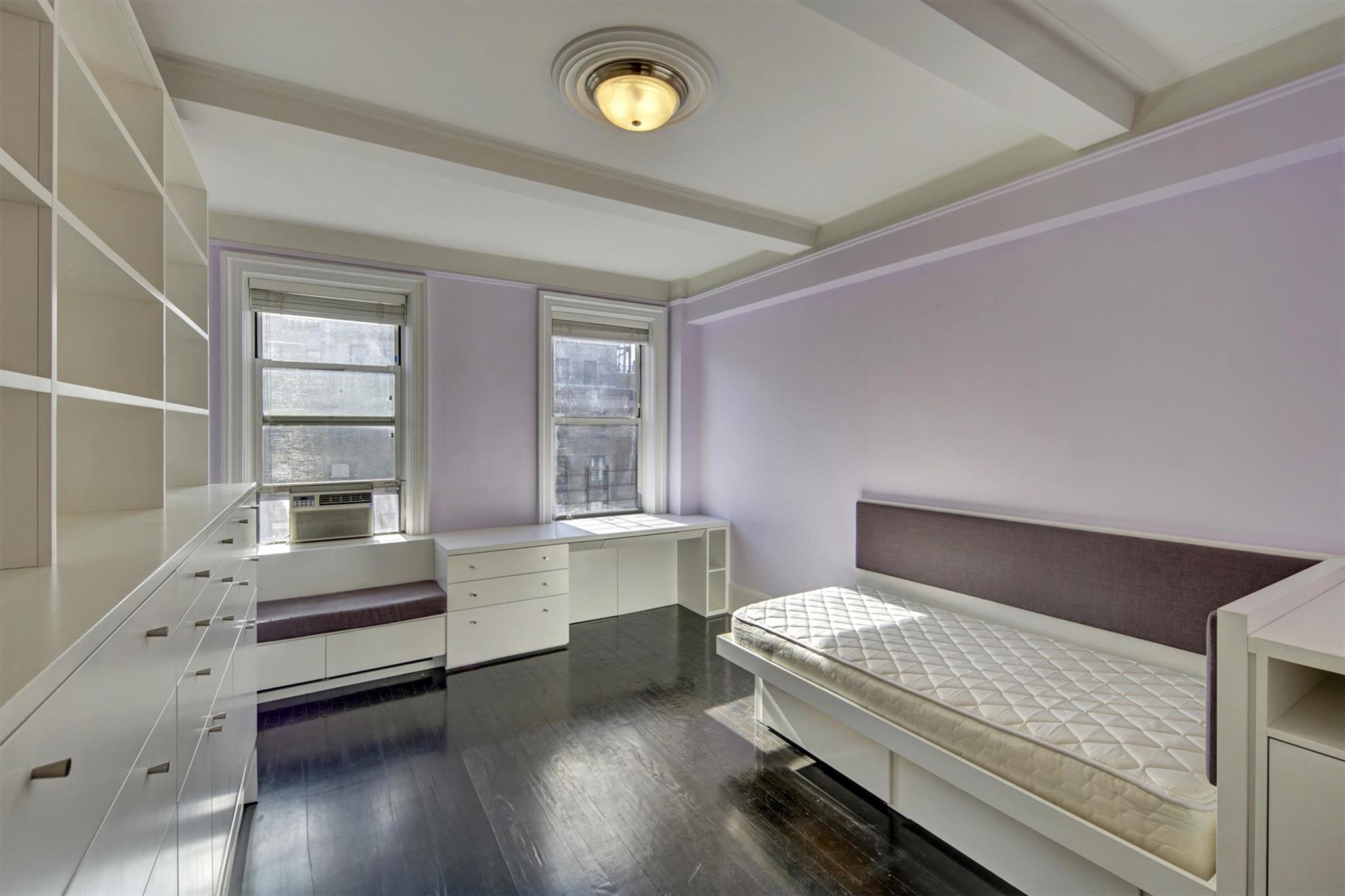 65 East 96th Street, Unit 16B Manhattan, NY 10128 - Photo 12 of 45 Bedroom featuring beamed ceiling, dark hardwood / wood-style flooring, and cooling unit