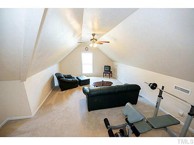 672 Seastone Street Raleigh, NC 27603 - Photo 18 of 23 Large bonus room with fan.
