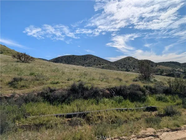 a view of mountains and valleys