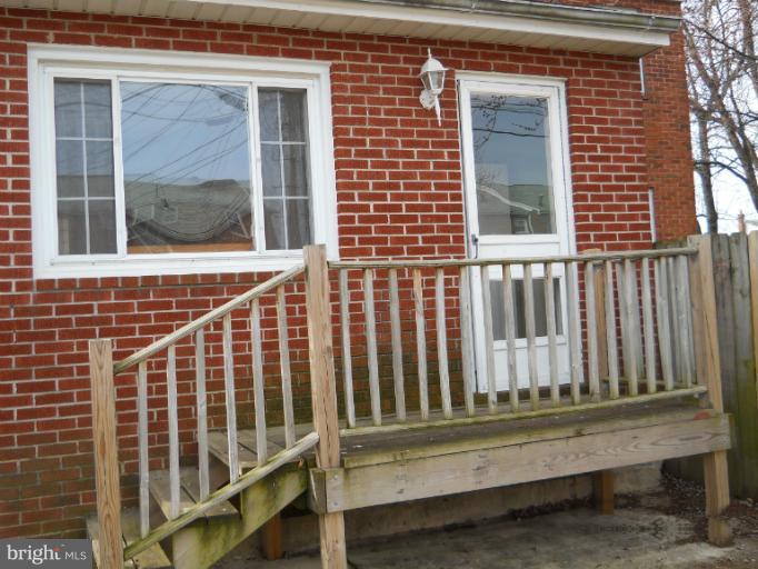 8186 Mid Haven Road Dundalk, MD 21222 - Photo 16 of 21 a view of a porch with a bench