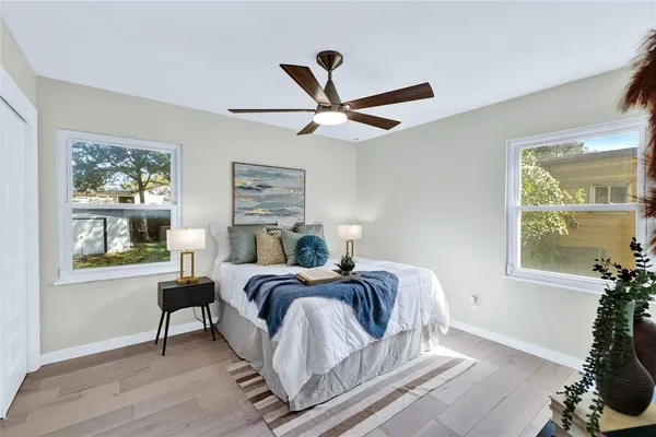 a bedroom with a bed and a window