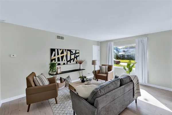 a living room with furniture and a window