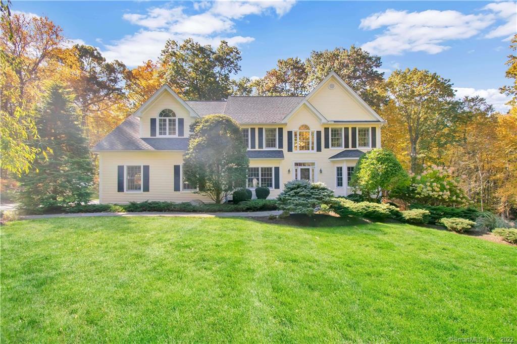 10 Hoseye Coach Road Newtown, CT 06482 - Photo 1 of 1 a front view of a house with a garden