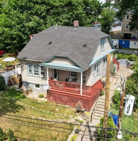 a aerial view of a house with swimming pool yard and outdoor seating