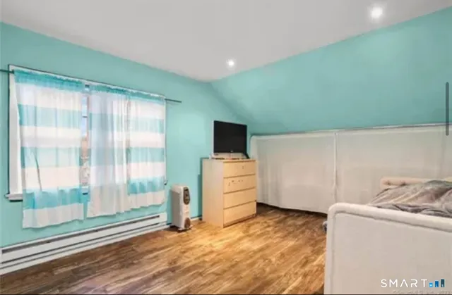 a room with furniture and a flat screen tv