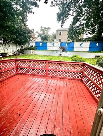 a view of outdoor space with deck and yard