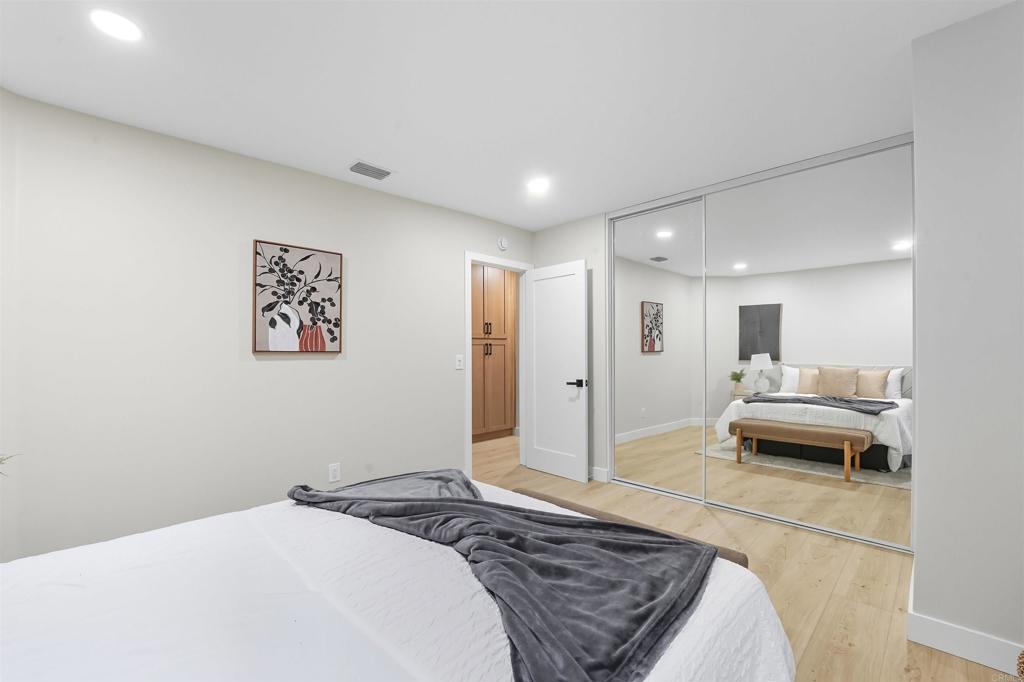 24350 Watt Road Ramona, CA 92065 - Photo 11 of 26 a spacious bedroom with a bed and a couch