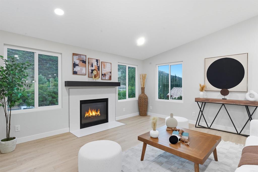 24350 Watt Road Ramona, CA 92065 - Photo 16 of 26 a living room with furniture and a fireplace
