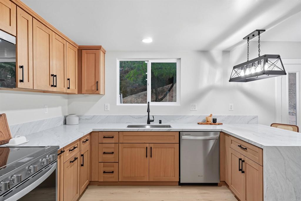 24350 Watt Road Ramona, CA 92065 - Photo 19 of 26 a kitchen that has a sink and a stove