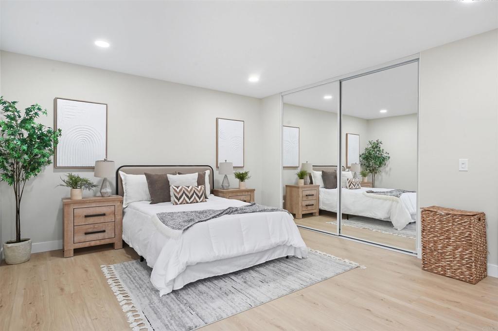 24350 Watt Road Ramona, CA 92065 - Photo 22 of 26 a bedroom with bed and a potted plant