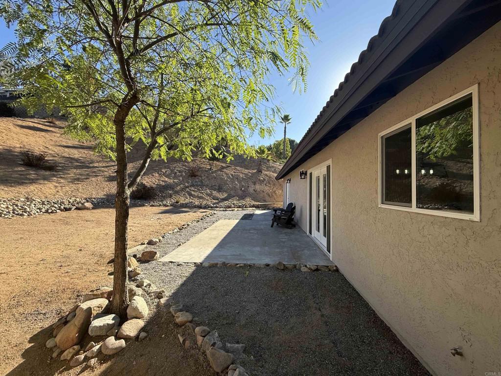 24350 Watt Road Ramona, CA 92065 - Photo 24 of 26 a view of a house with backyard and trees