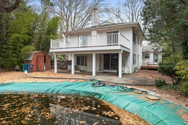 a view of a backyard with swimming pool