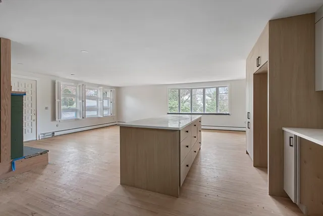 a view of a kitchen cabinets and wooden floor