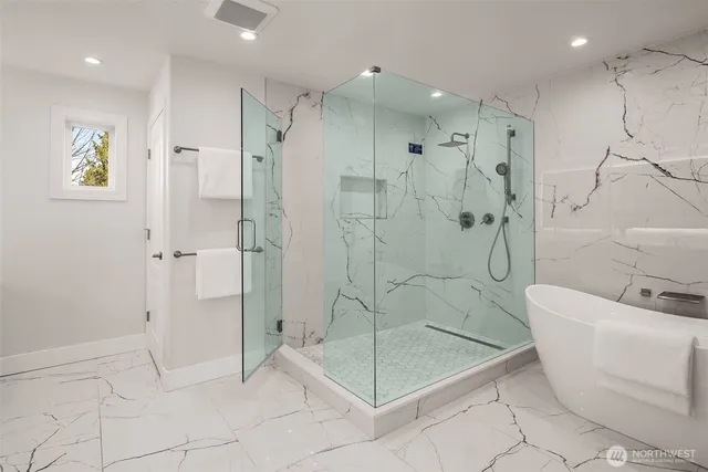 a bathroom with a shower and a bathtub
