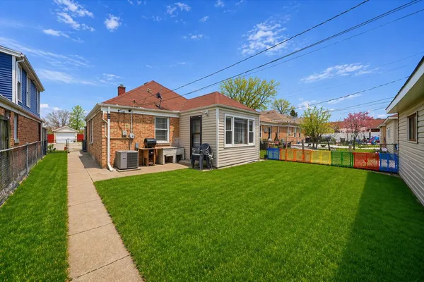 a view of a house with a back yard