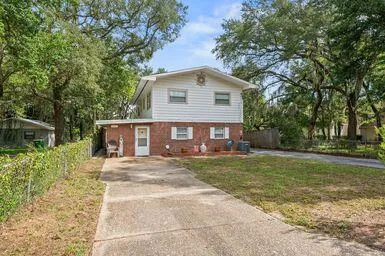 a view of a chairs and table in the balcony