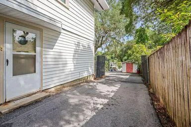 a view of a house with a tree front of house