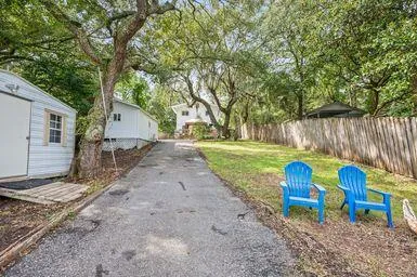 a kitchen with stainless steel appliances kitchen island granite countertop a stove and a sink