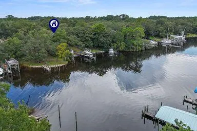 an aerial view of a house with outdoor space