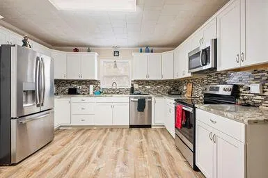 a bedroom with a bed and cabinets