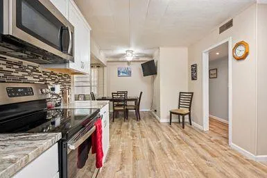a view of walk in closet with clothes
