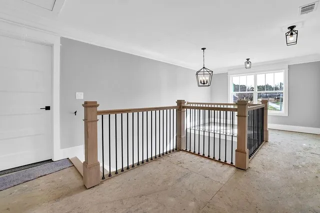 a view of a hallway with a chandelier