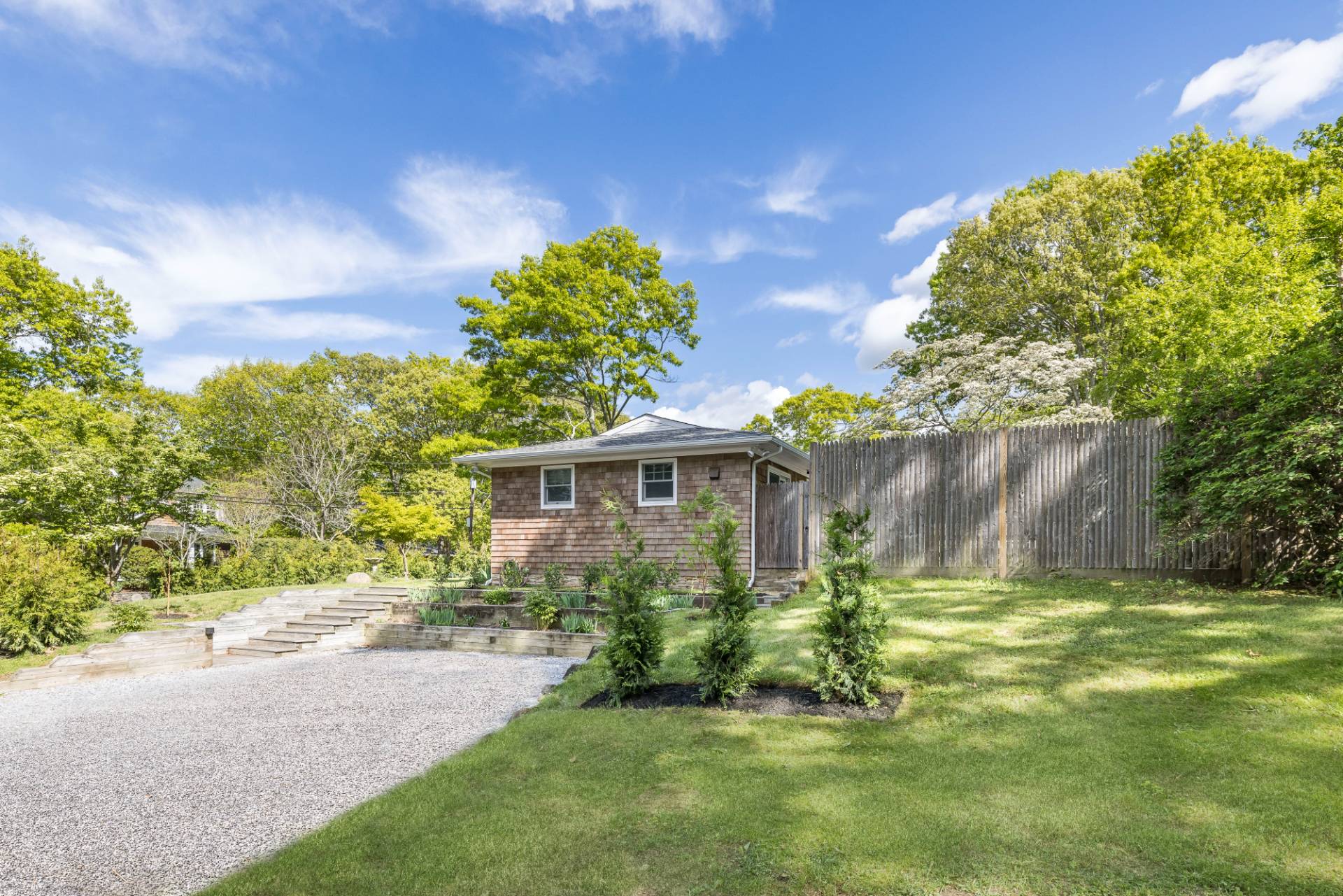 40 Ridge Road West Sag Harbor, NY 11963 - Photo 27 of 27 a garden with trees in front of it