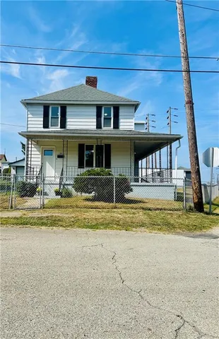 a view of swimming pool with a yard and plants