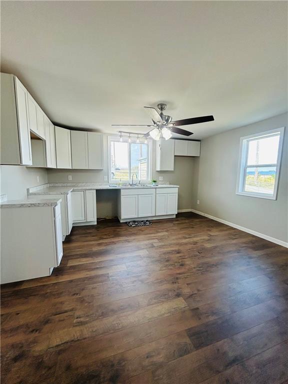 39 Murphy Street Uniontown, PA 15401 - Photo 12 of 35 a room with kitchen island stainless steel appliances wooden floor and chandelier