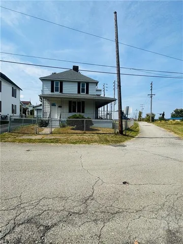 a view of a swimming pool with outdoor seating