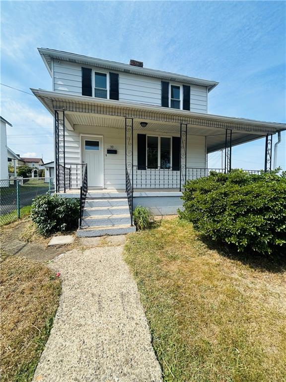 39 Murphy Street Uniontown, PA 15401 - Photo 31 of 35 a front view of a house with a yard