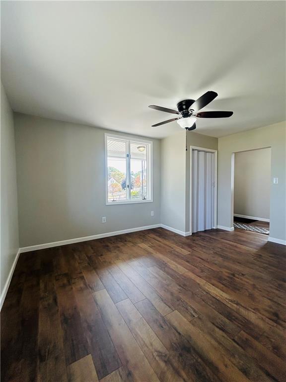 39 Murphy Street Uniontown, PA 15401 - Photo 4 of 35 a view of an empty room with wooden floor and a window