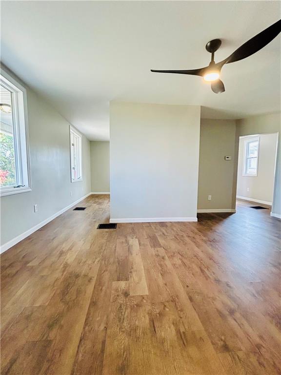 39 Murphy Street Uniontown, PA 15401 - Photo 9 of 35 an empty room with wooden floor and windows